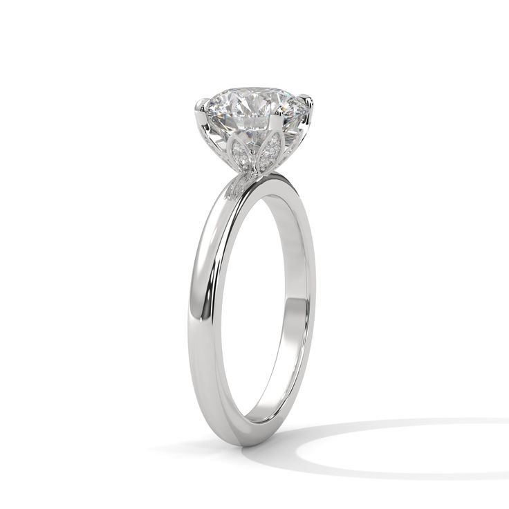 a diamond engagement ring on a white background