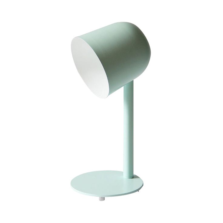 a green table lamp on a white background