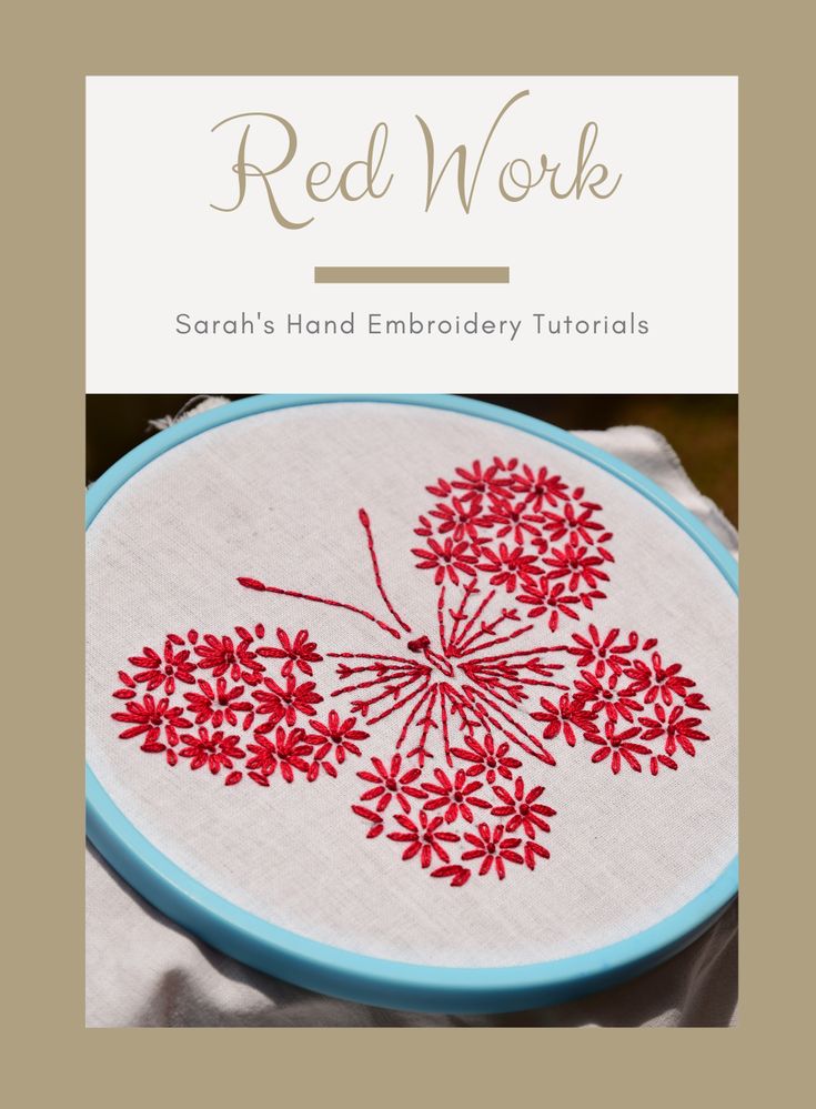 the red work embroidery pattern is displayed in front of a white cloth with blue trim