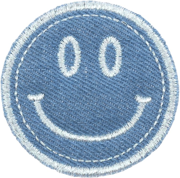 a smiley face embroidered on a blue jeanette cloth with white stitching in the middle