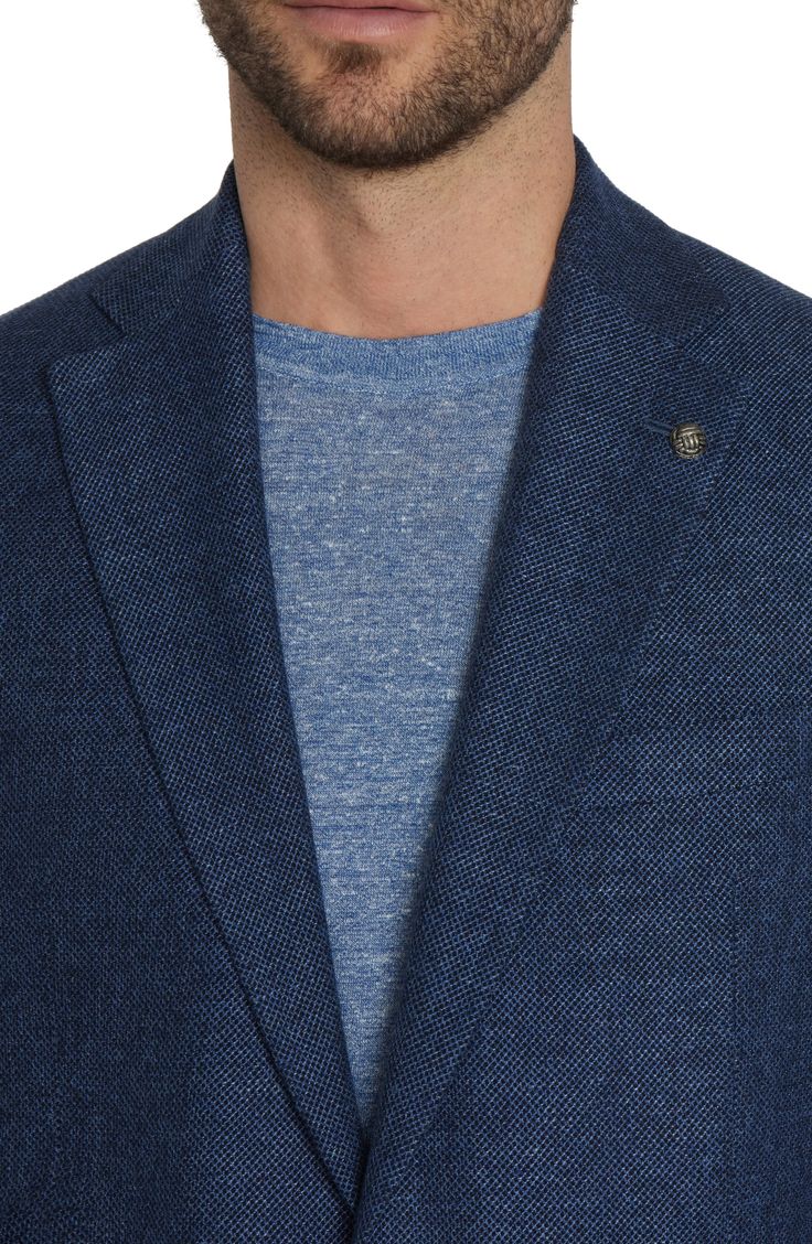 Constructed from a soft, wool-blend knit, this sport coat styled in a mottled blue features a relaxed profile that's ideal for elevating any casual look. 29 1/2" length (size 40R) Notched lapels Nonfunctional four-button cuffs Side vents Chest welt pocket; front patch pockets Partially lined 48% wool, 33% linen, 15% cotton, 2% silk, 2% elastane Dry clean Made in Canada Casual Wool Tweed Jacket For Spring, Casual Spring Wool Tweed Jacket, Casual Spring Tweed Wool Jacket, Blue Wool Tweed Jacket For Fall, Casual Tweed Outerwear With Welt Pockets, Casual Wool Tweed Jacket For Business, Casual Tailored Tweed Outerwear, Casual Wool Tweed Jacket For Business Casual, Tailored Casual Blue Blazer