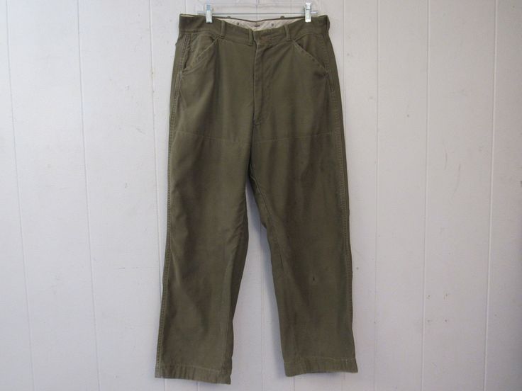 "Vintage 1960s green cotton hunting pants. Has a zip fly, five pockets, suspender buttons, double thick knees and double thick seat. Made by American Field. Actual measurements are: 34\" around the waist 28\" inseam 40\" overall length In good condition with a hole in the waist lining(photo) and some spots. About 4\" of the seat lining stitching is undone(photo)." Vintage Cotton Bottoms For Outdoor, Vintage Cotton Cargo Pants For Outdoor, Vintage Green Cargo Pants, Vintage Cotton Work Pants With Patch Pockets, Vintage Green Work Pants With Pockets, Vintage Cotton Outdoor Pants, Vintage Green Cotton Work Pants, Vintage Full-length Work Pants With Welt Pockets, 1960s Pants