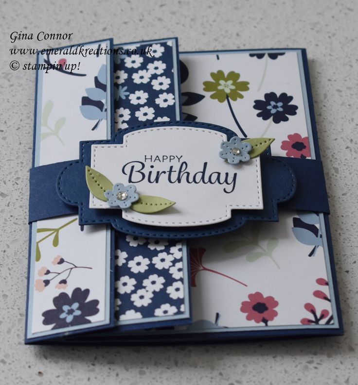 a close up of a birthday card with flowers on the front and back of it