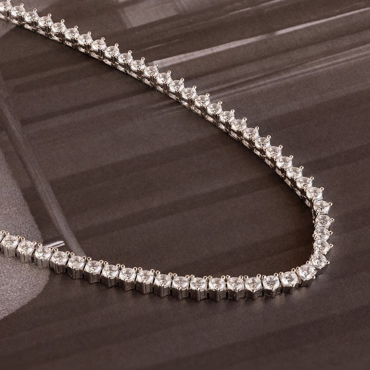 Our Bold Diamond Tennis Necklace is the only thing you will want to accessorize with. The glimmer of the diamond gemstones and the daintiness of the chain will put you in the spotlight when you want to be. Wear this beautiful necklace to a wedding or a date night; you will be sure to stand out ♡ SKU: RR-NR203 Product Details Material: High Quality Solid 925 Sterling Silver Finish: 18K Gold ∙ Sterling Silver Featuring a Classic Diamond Tennis Necklace with ~3mm Diamond CZ Gemstones, adjustable fr Party Diamond Clavicle Chain Necklace, Fine Jewelry Diamond Necklace With Crystal Accents, Luxury Silver Crystal Solitaire Necklace, Dazzling Diamond White Necklace With Diamond Accents, Dazzling White Gold Necklace For Formal Events, Fine Jewelry Tennis Necklace With Diamond Accents As Gift, Fine Jewelry Diamond Tennis Necklace Gift, Diamond Tennis Necklace As Gift, Fine Jewelry Diamond Tennis Necklace As Gift