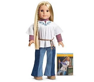 the doll is wearing jeans and a white shirt