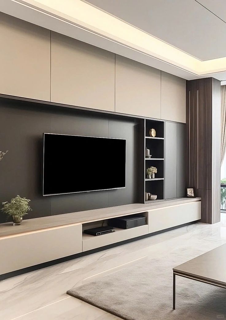 a living room with a large flat screen tv mounted to the side of a wall