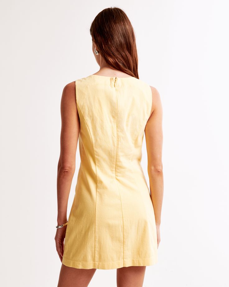 Brighten your wardrobe with the Abercrombie & Fitch Women's High-Neck Stretch Mini Dress in a vibrant Sunny Yellow. This chic, slim-fitting mini dress is perfect for any occasion, blending comfort and style seamlessly.

- Size: XL Petite
- Color: Sunny Yellow
- Material: Body - Cotton, Elastane
- Gender: Female
- Features: High-neck detail, flattering seaming details, non-functional front pockets

Crafted from a stretch-enhanced cotton fabric, this dress offers both flexibility and a flattering Solid Cotton V-neck Mini Dress, Lined Knee-length Mini Dress For Daywear, Cotton Lined Mini Dress, Fitted Cotton V-neck Mini Dress, Spring Stretch Mini Dress With Back Zipper, Spring Sleeveless Stretch Cotton Dress, Fitted Solid Color Cotton Mini Dress, Summer Mini Dress With Back Zipper For Work, Stretch Cotton Sleeveless Dress For Spring