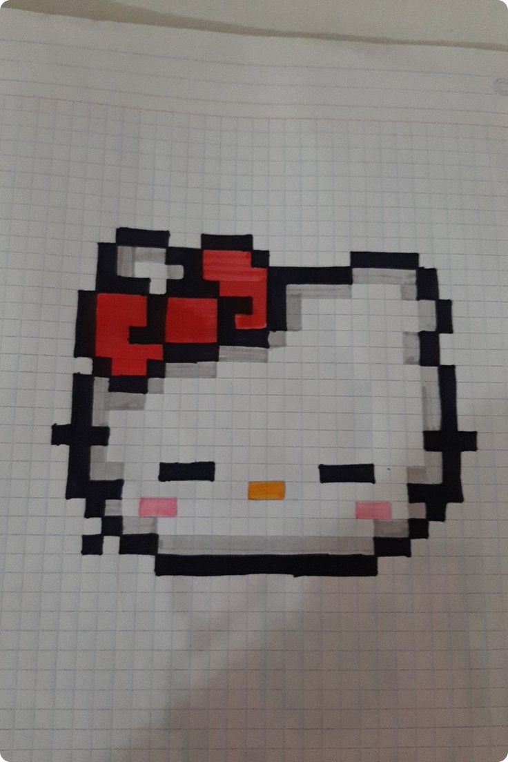 a piece of paper with an image of a hello kitty face drawn in squares on it