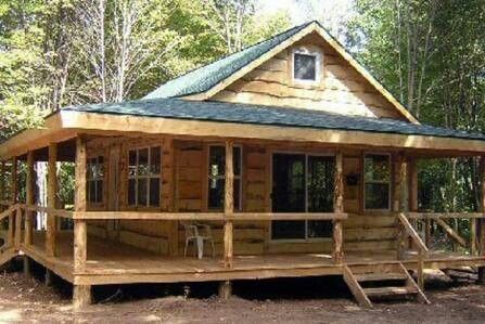 a small wooden cabin in the woods