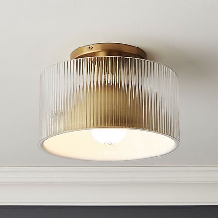 a close up of a light fixture on a ceiling in a room with white walls