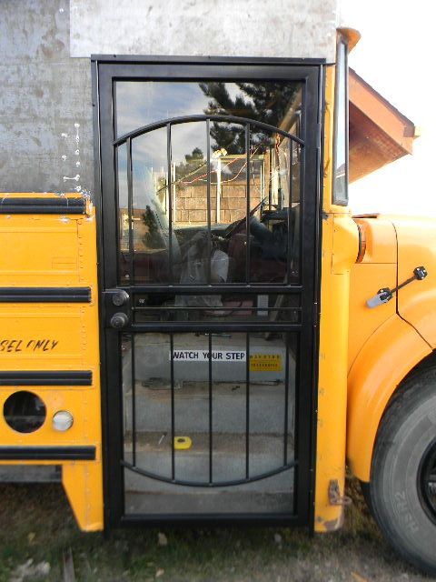 a yellow school bus with its door open