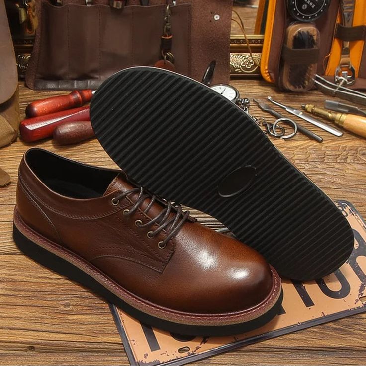 Revitalize your wardrobe with these men's Oxford shoes, featuring a round toe and thick soles for added style. Crafted from genuine leather, the lace-up closure ensures a secure fit. The pigskin insole and rubber outsole offer comfort for daily wear. Don't miss the chance to elevate your style with this perfect blend of retro charm and modern comfort. Grab yours now and step into fashion-forward confidence! Specifications Brand Name: GeraldBlack Shoes Type: BasicOrigin: Mainland ChinaSeason: Spring/AutumnUpper Material: Genuine LeatherUpper-Genuine Leather Type: Cow LeatherFit: Fits true to size, take your normal sizeModel Number: SHOE-TR-2477Closure Type: Lace-upItem Type: OxfordsFashion Element: SewingDepartment Name: AdultOutsole Material: RubberPattern Type: SolidFeature: BreathableFea Classic Leather Lace-up Shoes With Lug Sole, Classic Lace-up Leather Shoes With Lug Sole, Leather Moc Toe Oxfords With Lug Sole, Leather Oxfords With Moc Toe And Lug Sole, Masculine Lace-up Shoes With Rubber Sole And Round Toe, Masculine Leather Shoes With Textured Sole And Round Toe, Classic Brown Leather Shoes With Lug Sole, Masculine Brown Lace-up Oxfords, Lace-up Oxford Leather Shoes With Rubber Sole