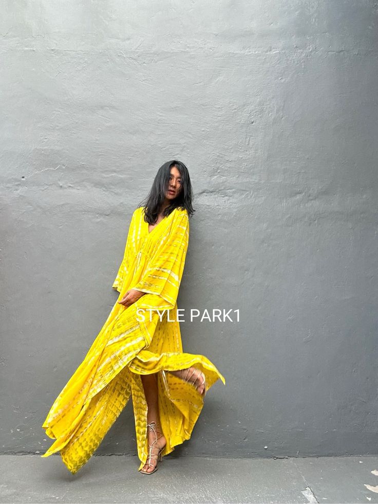 Uluwatu Kaftan dress" Soft, Smooth, Lightweight Rayon voile Fabric. Perfect for Elegant Day and Nightwear or worn as a cover-up for that beach or poolside statement of glamour. And for Muslim women   Color - Bali  Tie Dyed Lemon yellow & multi motif Measurements in CM and Inches.  Size American measurement is Medium to Large.  It fits all the body sizes between M to2XL Size - One size fits all American size From M to 2XL Total wide /240cm/94inch(round) Chest & him /180cm/70inch(round) The length /140cm/55inch We recommend all types of ladies you can surly accessorize with it to create your glamorous looks.  👉Please choose carefully Color & Size 👈  Iphone 14Photos therefore, the color can be slightly different between the real products and photos. Flowy Boho Sundress For Beach Cover-up, Yellow V-neck Beachwear Maxi Dress, Long Boho Dress For Beach Cover-up, Yellow Beachwear Kaftan For Summer, Bohemian Flowy Tunic Maxi Dress, Yellow Summer Beachwear Kaftan, Flowy Bohemian Tunic Maxi Dress, Yellow Summer Kaftan For Festivals, Long Summer Festival Kaftan