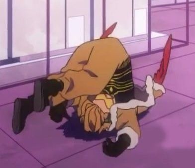 an anime character laying on the ground with his head down and one leg up in front of him