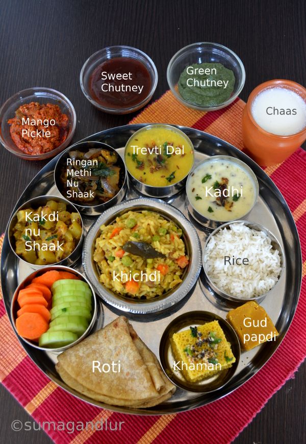 a metal plate topped with different types of food