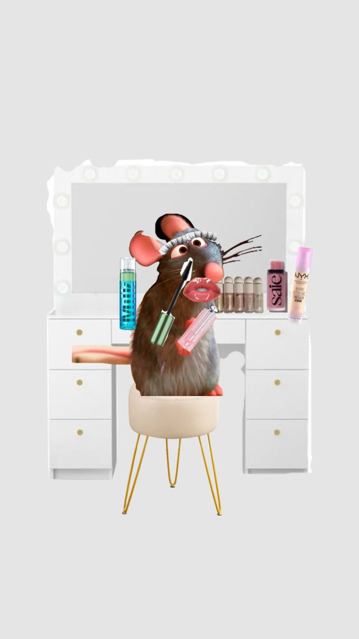 a mouse sitting on top of a chair in front of a desk with makeup and other items