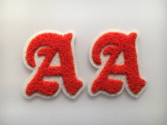 two red and white letters with the letter a on them