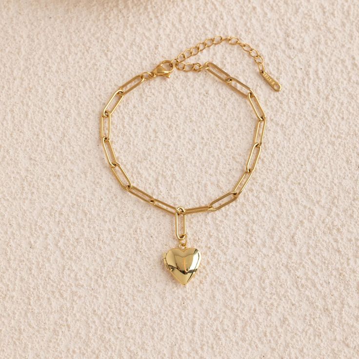 Personalized Mini Heart Bracelet, Photo Locket Bracelet, Vintage Locket Bracelet, Memorial Jewelry, Trendy Best Gift, Christmas Gift 🌟Color: gold, silver 🌟Pendant size: 13×16MM 🌈This mini heart bracelet is not just a delicate piece of jewelry but also a meaningful way to preserve cherished memories. Whether celebrating a special moment or expressing deep affection for a loved one, this bracelet seamlessly connects love and memories, allowing you to carry them with you wherever you go. 💡Highl Dainty Metal Charm Bracelet For Valentine's Day, Gold Metal Charm Bracelet With Heart Beads, Adjustable Dangle Bracelets For Valentine's Day, Heart-shaped Metal Chain Bracelet Gift, Mother's Day Heart-shaped Metal Charm Bracelet, Heart Charm Chain Bracelet For Wedding And Valentine's Day, Gold Heart Charm Bangle Bracelet, Heart-shaped Metal Bracelets For Wedding, Heart Shaped Metal Bracelets For Wedding