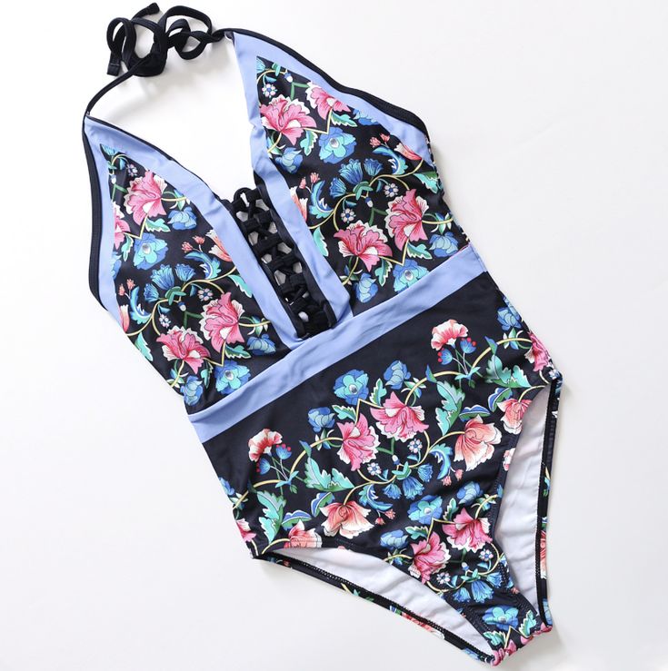 FINAL SALE: This item cannot be returned or exchanged. Embrace timeless elegance with the One Piece Women Floral Swimsuit. This sophisticated swimsuit features a beautiful floral print that exudes a fresh, summery charm, perfect for sunny days by the water. Designed with both style and comfort in mind, it offers a flattering fit that enhances your natural silhouette. The durable fabric provides excellent support, ensuring you feel confident and chic whether lounging poolside or enjoying a seaside escape. Step into effortless glamour with this stunning floral one-piece swimsuit, a must-have addition to your swimwear collection. Floral Print Halter Neck Tankini For Swimming, Tropical Halter Neck Tankini For Spring, Summer Floral Print Halter Neck Tankini, Halter Neck Tankini With Floral Print For Poolside, Summer Floral Print Halter Neck Swimwear, Fitted Printed Swimwear For Summer Parties, Floral Print Halter Neck Swimwear For Summer, Tropical Halter Neck Swimwear With Floral Print, Spring Halter Neck Tankini