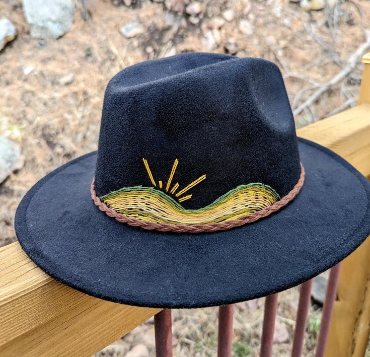 Up your fashion game this spring with this addition to your closet. This gorgeous bohemian style wide-brim felt hat with a hand-embroidered mountains and sun scene. Eclectic, boho and modern style all in one! A wonderful item to add to your closet for any woman who likes to stand out and make a statement with her fashion. Adjustable ❁ Fashionable ❁ One Size Fits Most ❁ Sun Protection ❁ Statement Piece ❁ Hand Embroidered  This is a beautiful one-of-a-kind, hand stitched statement fashion piece - no two designs are alike. Each hat I make is carefully curated, designed and hand-embroidered. I am very inspired by vintage, 60s and 70s fashion and love to design embroidery pieces that I would love to wear. I am dedicated to making you satisfied with you purchase. Please message me for custom req Bohemian Flat Brim Felt Hat For Summer, Bohemian Summer Felt Hat With Flat Brim, Bohemian Felt Hat For Beach Spring, Bohemian Felt Hat For Beach In Spring, Spring Bohemian Felt Hat For The Beach, Black Bohemian Felt Hat For Summer, Bohemian Fedora Felt Hat For Beach, Bohemian Felt Hat With Flat Brim For Vacation, Bohemian Flat Brim Felt Hat For Vacation