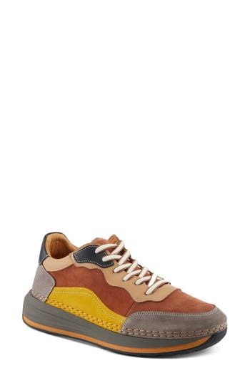 This sporty sneaker is topped with colorblocked leather and grounded on an exaggerated sole. 1 1/2" heel; 1" platform Lace-up style Removable, cushioned insole with arch support Leather upper and lining/synthetic sole Made in Turkey Multicolor Platform Sneakers With Contrast Sole For Streetwear, Sporty High-top Suede Chunky Sneakers, Sporty Multicolor High-top Sneakers With Contrast Sole, Multicolor Leather Sneakers For Streetwear, Multicolor Chunky Sneakers With Rubber Sole, Modern Multicolor Round Toe Sneakers, Multicolor High-top Platform Sneakers With Contrast Sole, Modern Low-top Chunky Sneakers With Vibram Sole, Low-top Suede Sneakers With Lug Sole