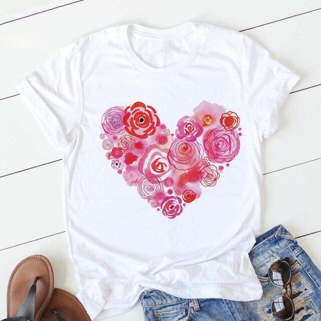 This delightful Pink Heart Flower Print T-Shirt combines cute style with practical comfort. The eye-catching print features delicate pink hearts intertwined with playful flowers, creating a feminine and fun aesthetic that's sure to brighten your day. Crafted from a lightweight, breathable fabric, this tee keeps you cool and comfortable whether you're running errands or meeting friends for coffee. The relaxed fit and soft texture make it an instant favorite in your casual rotation, while the dura Heart Flower, Personalized Letters, Sweet Style, Streetwear Women, Printed Sleeves, Flower Heart, Stylish Fashion, Heart Print, Haiti