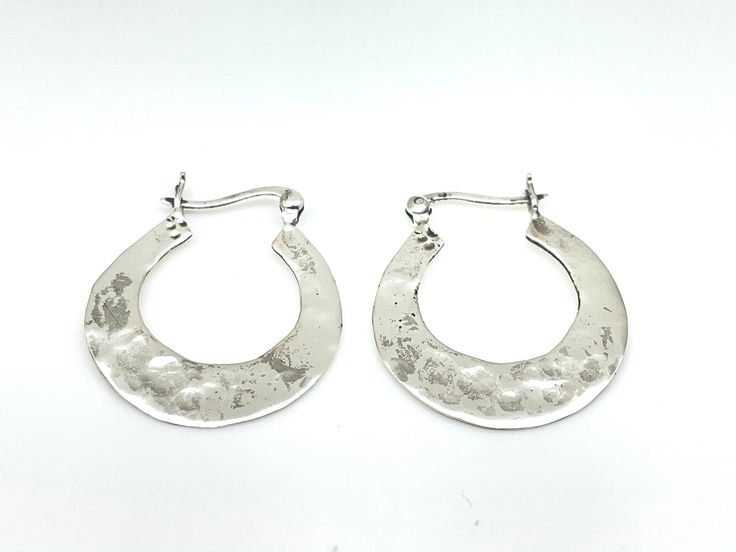 Hammered Silver Hoop Earrings - 925 Sterling Silver Height: 1.2 inches Weight: 4.5 grams Hallmark 925 Finish: hammered Silver Hammered Hoop Earrings For Anniversary, Small Hoop Hammered Silver Earrings, Silver Hammered Round Hoop Earrings, Everyday Small Hoop Earrings Stamped 925, Small Hammered Silver Hoop Earrings, Large Hoop Earrings, Simply Lovely, Hammered Silver, Silver Hoops