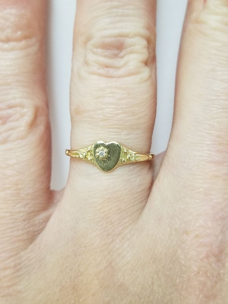 "Thanks for shopping our vintage estate store. We tend to sell well below wholesale and truly hope you enjoy all of our items. Many of the items are one of a kind, so please enjoy scrolling through the pictures and hopefully something will catch your eye. Black spots are from reflections. Estate 14k yellow or rose gold heart diamond ring. Beautiful ring, one that you will love. Color: Yellow or Rose Gold please select the color Ring size: 3 or 5 Setting: 6mm 1/4\" Band width: 1.2mm Weight: 1.25 Heart Diamond Ring, Beach Rings, Diamond Heart Ring, Heart Diamond, Rose Gold Heart, Band Engagement Ring, Engagement Bands, Diamond Rings Bands, Pinky Ring