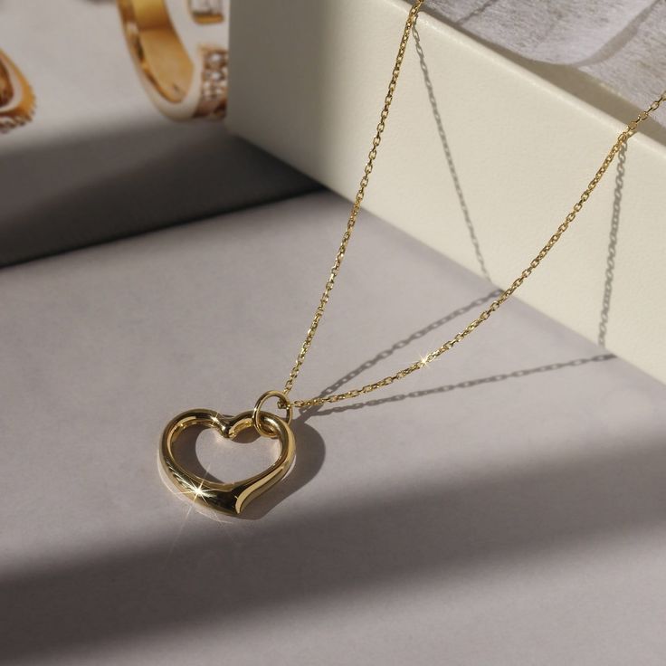 "✨💎 It gives you beautiful, attractive and outstanding jewelry experience ✨ * Everlasting Confidence * Wonderful Quality * Stay Shiny * Exquisite Fit * Over 17,000 cumulative user reviews, rating 4.8+/5 Chic Puffed Heart Necklace: Your Symbol of Love and Elegance Gold Elegance: A Touch of Class Embrace the luster and prestige of 14K Gold with the Chic Puffed Heart Necklace. Available in both classic yellow gold and the modern elegance of white gold, this piece is a testament to timeless beauty. Expertly crafted to be both durable and dazzling, it's more than a necklace--it's a statement of sophistication. Heartfelt Design: Open Heart, Open Style The heart is more than just a symbol of love; it's an emblem of your unique style. This necklace, with its high-polished, puffed open heart charm Puffed Heart Necklace, White Gold Pendant Necklace, Heart Charm Necklace, White Gold Pendant, Puffed Heart, Necklace Women, Symbol Of Love, Open Heart, Touch Of Class