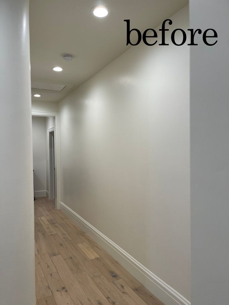 an empty hallway with white walls and wood flooring that says before on the wall