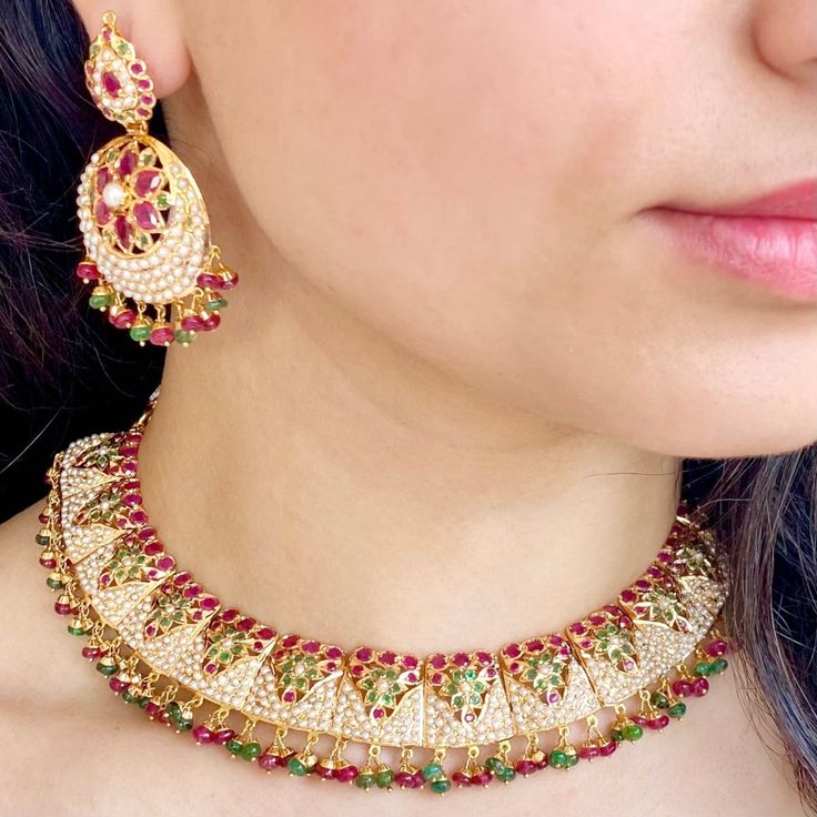 Featuring a necklace with matched pair of earrings in 22k gold. The necklace weighs 41.05 gms and the earrings weigh 22.5 gms Festive 22k Gold Jewelry Sets, Chandbali Necklaces With Matching Earrings For Diwali, 22k Gold Jewelry With Matching Earrings For Diwali, Festive 22k Gold Hand Set Jewelry Sets, Festive 22k Gold Hand-set Jewelry Sets, Festive 22k Gold Hand Set Jewelry, Festive 22k Yellow Gold Emerald Necklace, Festive Chandbali Necklaces With Matching Earrings, Hand Set 22k Gold Round Temple Necklace