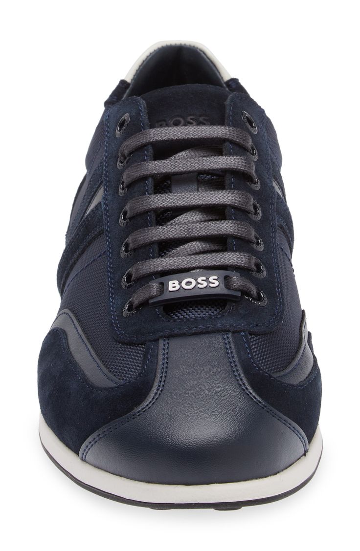 A contrasting low-top sneaker with a brand logo detail offers a refined take on sporting classic. Lace-up style   Leather upper/textile lining/rubber sole   Imported   Hugo Boss/BOSS/HUGO has received the Fair Labor Association accreditation, which signifies that the company has effective systems and procedures in place to successfully uphold fair labor standards throughout its supply chains, including strategies and tools to address and improve working conditions Classic High-top Sneakers With Logo And White Sole, Classic Lace-up Sneakers With Logo, Classic Navy Sneakers With Contrast Sole, Modern Sneakers With Logo Detail And Round Toe, Modern Round Toe Sneakers With Logo Detail, Classic Lace-up High-top Sneakers With Logo Detail, Classic Lace-up High-top Sneakers With Logo, Modern Lace-up Sneakers With Logo Detail, Classic Low-top Sneakers With Logo Detail