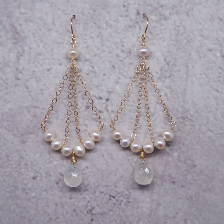 Handmade White Chandelier Earrings For Anniversary, Graceful Dangle Bridal Earrings For Gift, Elegant Briolette Crystal Earrings Gift, Elegant Natural Stone Pearl Earrings For Anniversary, White Pearl Earrings With Natural Stones For Wedding, White Natural Stone Pearl Earrings For Wedding, Pearl White Chandelier Earrings With Pearl Charm, Delicate Pearl Drop Chandelier Earrings As Gift, Elegant Pearl Drop Moonstone Jewelry