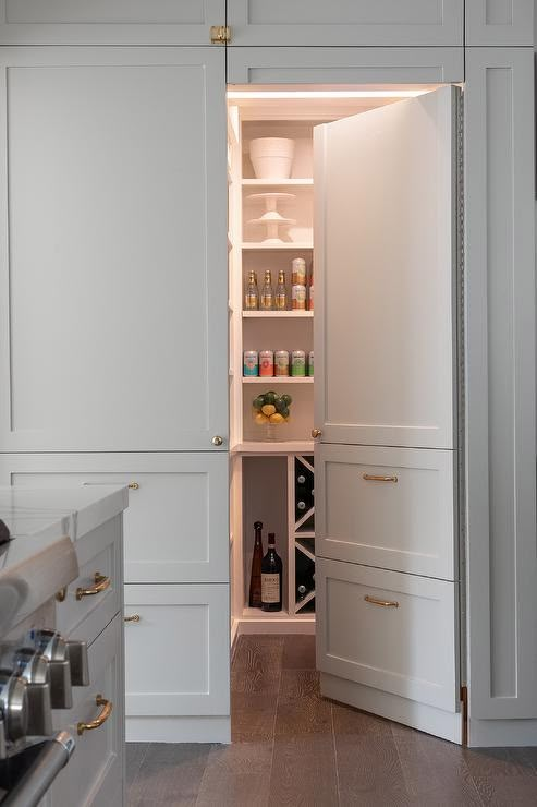 an open pantry with wine bottles in it