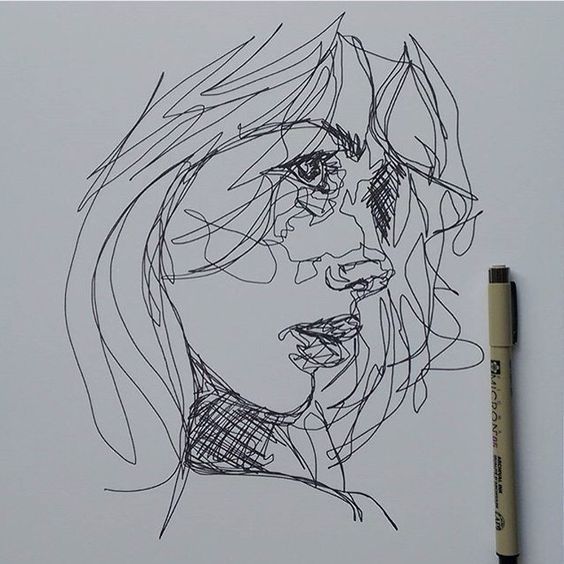 a pencil drawing of a woman's face on a piece of paper next to a marker