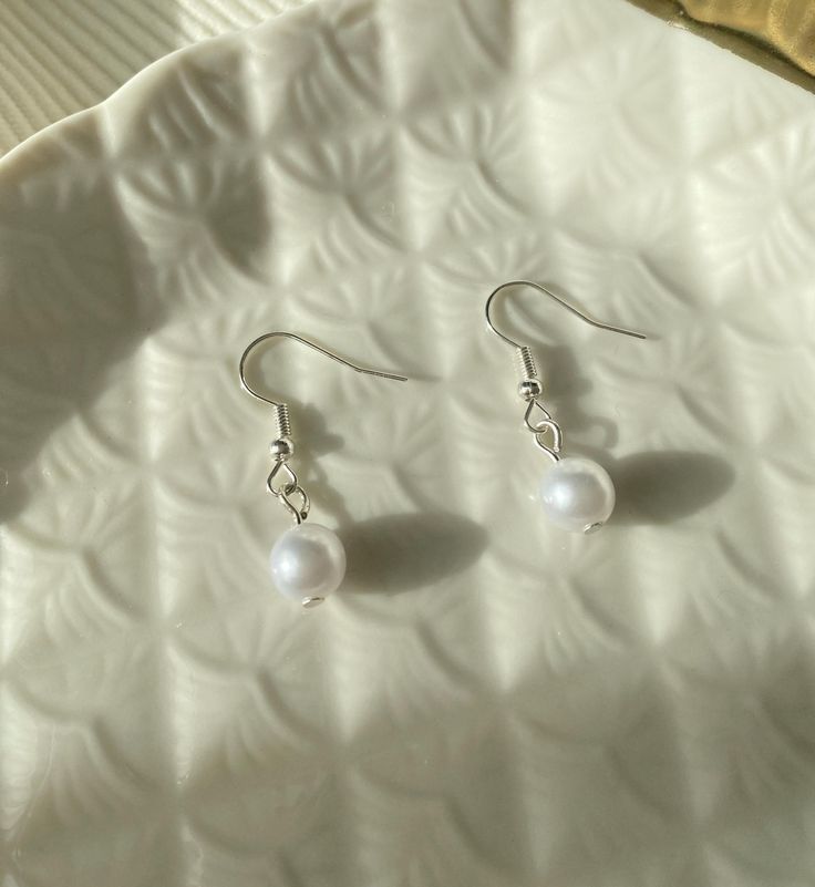 This pair of earring is perfect for everyday wear and it perfect gift for birthday, friendships, holidays, etc. ♡ Material: S925 high-quality sterling silver or 18k gold plated, White imitation pearls. ♡ Packaging / Gift box: All jewelry is carefully packed in our gift boxes. All my products are handmade, so there will be some variation in dimensions. Thank you so much for visiting and hope you enjoy shopping with us. --------------- Please find more of my products in the link below: https://annbecraft.etsy.com AnnbeCraft♡ Cheap Teardrop Jewelry With Pearl Charm, Cheap Dangle Jewelry With French Hook, Affordable Hypoallergenic Dangle Pearl Earrings, White Dangle Crystal Earrings Gift, Delicate White Crystal Earrings For Gift, White Hypoallergenic Drop Crystal Earrings, Gift Pearl Drop Clip-on Earrings, Dangle Pearl Earrings For Gifts, Pearl Dangle Earrings As Gift