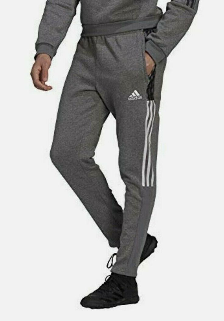 Adidas Men Tiro 21 Sweat Pants Grey  (GP8802) TAPERED SWEAT PANTS FOR OFF-PITCH COMFORT. Relax, regroup, recover. These adidas sweat pants are ideal for the quieter moments of soccer, like stretching before a match or heading home when training is over. The cotton-blend fleece feels soft and cozy. Zip pockets keep essentials close. This product is made with recycled content as part of our ambition to end plastic waste. WASHING INSTRUCTIONS Do not bleach Tumble dry low heat Do not dry clean Touch Adidas Gym Pants With Three Stripes, Adidas Cotton Gym Pants, Adidas Moisture-wicking Sweatpants For Jogging, Adidas Cotton Sweatpants For Gym, Adidas Cotton Joggers For Gym, Sports Sweatpants With Three Stripes, Adidas Joggers With Pockets For Sports, Adidas Joggers For Sports, Adidas Athleisure Sweatpants For Gym