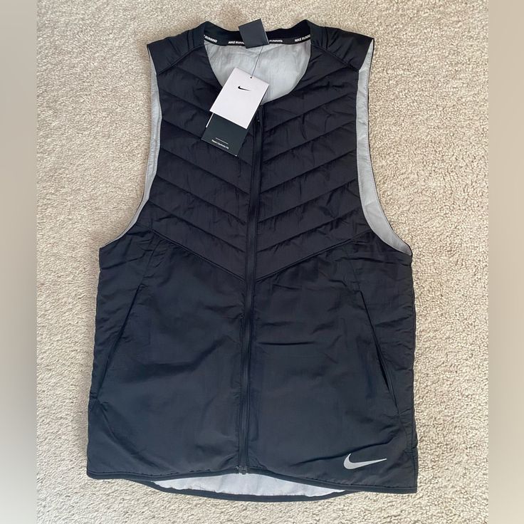 Nike Aerolayer Vest Size Small Color Black Nwt Sporty Winter Vest For Layering, Functional Black Outerwear For Spring, Functional Black Vest For Fall, Functional Black Spring Outerwear, Black Sports Vest For Winter, Black Winter Sports Vest, Sporty Black Vest For Spring, Functional Black Winter Vest, Nike Black Outerwear For Work