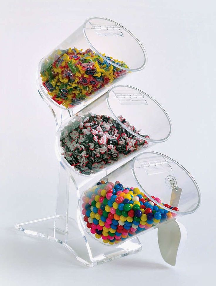 three tiered plastic candy dispenser filled with candies