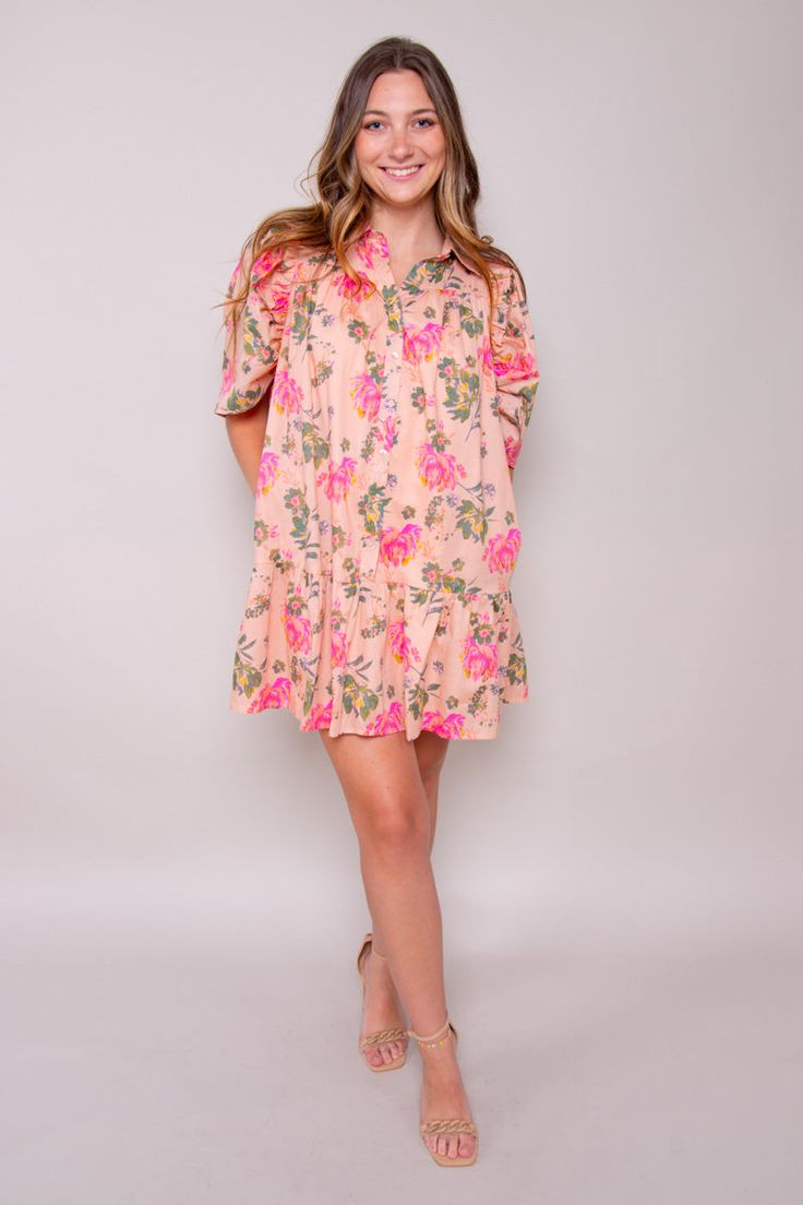 Step into summer with our Peachy Breeze Dress—a charming addition to your wardrobe that embodies the essence of blooming tropic and gentle breezes. Crafted from a lightweight printed woven fabric, this mini dress features a classic shirt collar and short puff sleeves, evoking a sense of vintage-inspired elegance. Self: 100% Polyester Lining: 100% Polyester Hand Wash Cold Colors may vary with different viewing devices. Collared Dresses For Spring Garden Party, Pink Rose Print Summer Floral Dress, Pink Rose Print Floral Dress For Summer, Summer Feminine Collared Mini Dress, Pink Collared Dress For Vacation, Spring Feminine Collared Mini Dress, Breezy Short Sleeve Dress For Spring, Feminine Floral Print Short Sleeve Dress, Spring Collared Feminine Mini Dress