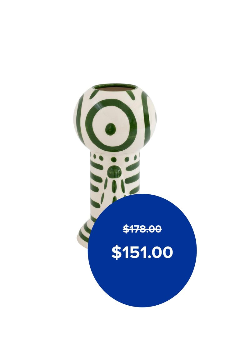 a ceramic figurine with a $ 15 00 price tag