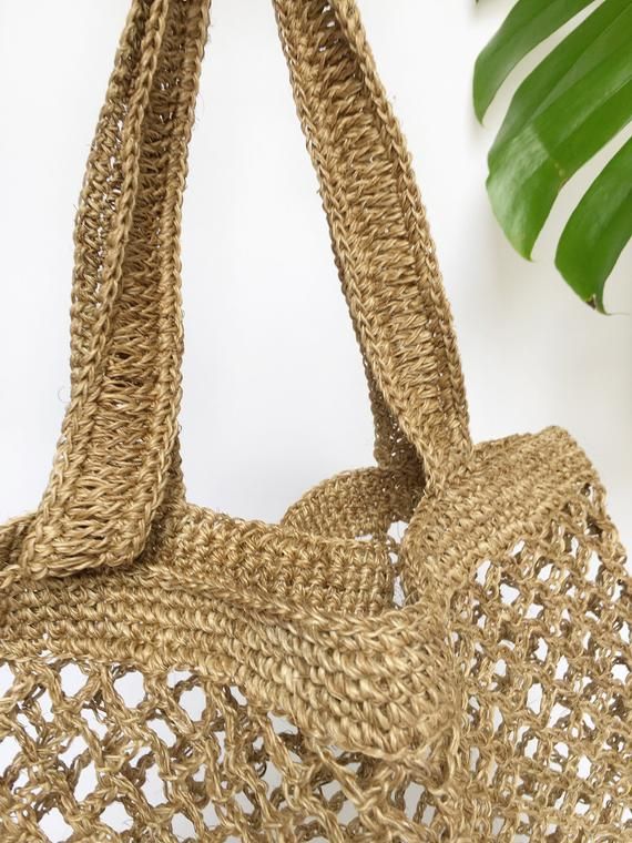 Stylish and on trend, this beautiful tote is handmade by artisans from Santander, Colombia. 100% made of Fique natural fiber, a plant similar to Agave, it is the perfect summer accessory to be used out in the city or to spend a day at the beach. With two easy to carry handles, you will want to carry it around everywhere you go!Approximate Dimensions:Height: 17" / 43 cmWidth: 16.1” / 41 cmStrap drop: 9"/ 23 cmAll of our bags are 100% handmade from natural fibers. Please allow for any color and si Lightweight Natural Crochet Bag For Daily Use, Eco-friendly Double Handle Jute Bag, Eco-friendly Jute Bag With Double Handle, Eco-friendly Beach Bag With Open Weave, Eco-friendly Brown Bag With Open Weave, Eco-friendly Sand Shoulder Bag For Daily Use, Open Weave Jute Shoulder Bag With Double Handles, Double Handle Jute Shoulder Bag With Open Weave, Eco-friendly Natural Fiber Bag With Double Handle