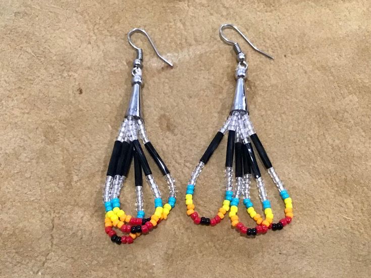 "Authentic Beautiful Native American Indian Jewelry Navajo Hand Beaded Long Dangle Earrings. Great for a gift❤️ Handcrafted by Navajo Artist R. Sellers These beautiful earrings are 2 7/8\" in length and 1\" in width." Adjustable Southwestern Beaded Earrings With Ear Wire, Southwestern Style Earrings With Dangling Round Beads, Southwestern Dangle Beaded Earrings, Southwestern Style Multicolor Jewelry With Black Beads, Southwestern Adjustable Dangling Bead Earrings, Adjustable Southwestern Beaded Earrings, Southwestern Teardrop Beaded Earrings, Southwestern Multicolor Beaded Earrings, Simple Bead Earrings