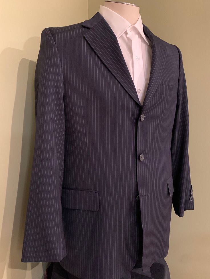 "Beautiful 100% worsted wool Super 120s suit from Hart, Schaffner Marx. The pattern is navy blue with a light blue pinstripe. The jacket has lightweight padded shoulders, a 3-button closure, 4-button cuffs & is partially lined. The slacks are cuffed, have suspender buttons & have two rear pockets. The condition is like new vintage.  Shirt in photos not included. SIZE: Medium  (See Measurements Below) JACKET Shoulder Seam to Shoulder Seam: 17\" Shoulder Seam to Cuff End: 23 3/4\" Underarm Seam to Pinstripe Business Suits With Long Sleeves, Pinstripe Long Sleeve Business Suits, Pinstripe Suits With Long Sleeves For Business, Classic Long Sleeve Pinstripe Suits, Striped Business Blazer With Hidden Button Closure, Striped Business Blazer With Hidden Buttons, Striped Blazer With Hidden Button Closure For Business, Pinstripe Notch Lapel Business Outerwear, Pinstripe Notch Lapel Outerwear For Business