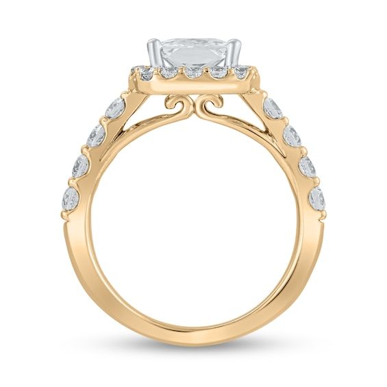 a yellow gold engagement ring with an oval cut diamond center and side stones on the band