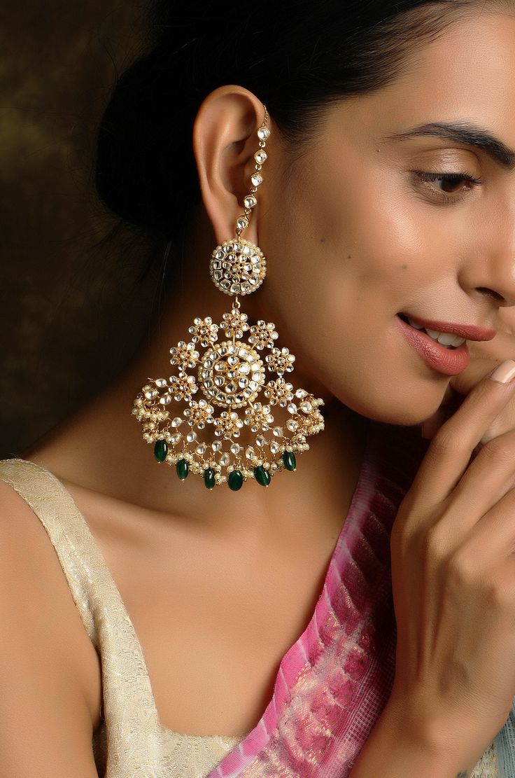 Kundan work inspired Indian earrings with high graded shell pearls. Earrings based in silver and copper alloy. It will elevate your quotient in no time. Earrings Length - 6 cm Closure - Push Pin Style Tip - Wear this with almost anything Indian for a rich and royal look because nothing more regal than kundan earrings. We love teaming this with classy chiffon sarees or zari silk sarees. Also looks best when worn with your royal whites, off whites and gold. We recommend styling with bold solids or Polki Earrings Designer, Bridal Earrings Indian, Pakistani Pret Wear, Pearl Long Earrings, Pret Wear, Kundan Work, Indian Jewelry Earrings, Polki Earrings, Antique Jewellery Designs