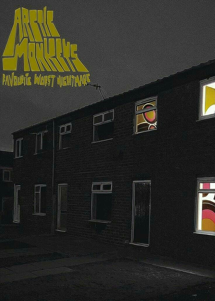 an image of a building that is lit up at night with the words arctic monkeys on it