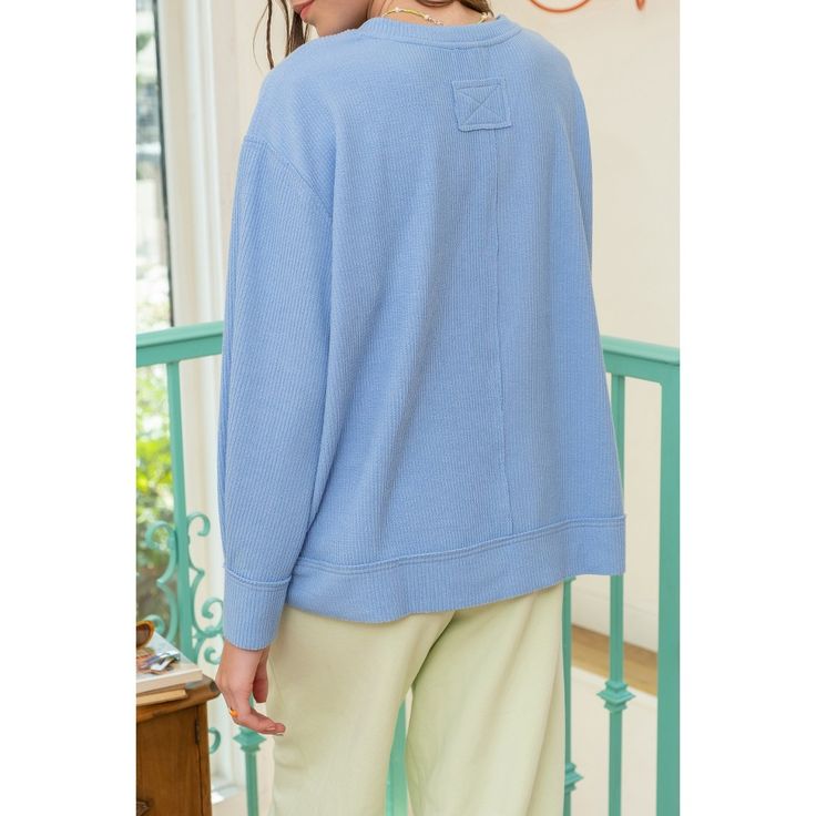 Elevate your everyday style with our August Sky Women's Raw Edge Split Neck Knit Pullover Top. This cozy, ribbed knit top features a modern split neckline and relaxed, comfortable fit. Its trendy dropped shoulders, long sleeves, and raw edge details add a touch of effortless chic. Complete with a split hemline for added flair, this versatile top seamlessly blends comfort and fashion. Ideal for any occasion, it's a must have addition to your wardrobe. Oversized Casual V-neck Sweater For Loungewear, Spring Ribbed V-neck Sweater For Loungewear, Solid Crew Neck Knit Top For Loungewear, Relaxed Fit Knit Top With Ribbed Neckline For Layering, Casual Oversized V-neck Sweater For Loungewear, Casual Cotton V-neck Sweater For Loungewear, Trendy Oversized Ribbed V-neck Sweater, Spring Ribbed V-neck Loungewear Sweater, Oversized Blue Ribbed Top