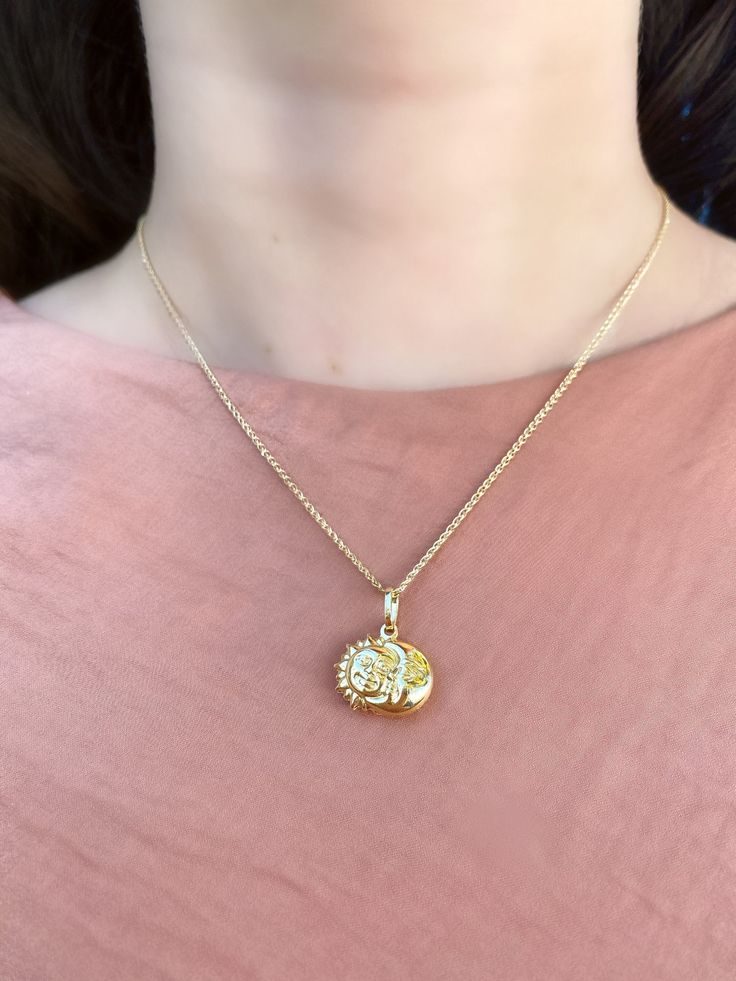 This fascinating and versatile necklace features the moon and sun, a symbol of inspiration and hope to many. Two celestial motifs shine brightly in 14K YellowGold, for a gorgeous high polish look. The sun and moon are joined together creating this gorgeous pendant. Suspends from a chain with spring-ring closure. A glam and a meaningful gift idea. Metal: Real 14K Yellow Gold (Stamped) Closure of Necklace: Spring- Ring Clasp Necklace Length: 16 or 18 inches Sun& Moon Pendant Dimensions: approx Celestial Round Necklace For Meditation, Celestial Necklaces For Meditation, Celestial Style Necklace With Moon Charm, Moon Phase Coin Necklace With Round Pendant, Spiritual Moon Phase Round Pendant Necklace, Moon Phase Medallion Necklaces Styled As Amulets, Moon Phase Medallion Necklace In Amulet Style, Spiritual Crescent Yellow Gold Necklace, Bohemian Necklace With Sun And Moon Round Pendant