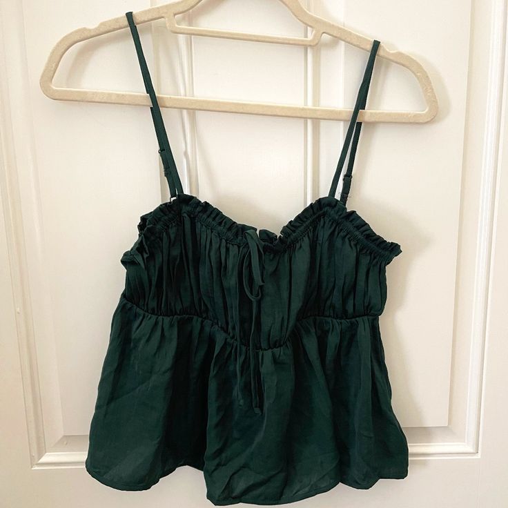 Deep Emerald Green Camisole Top With Adjustable Spaghetti Straps. Size Small, Never Worn. Bow Detail On Front. Forest Green Tops, Green Vacation Top With Built-in Bra, Green Casual Crop Top With Adjustable Straps, Casual Green Crop Top With Adjustable Straps, Green Cotton Camisole With Tank Straps, Green Cotton Tank Camisole, Green Camisole Crop Top For Spring, Summer Tank Strap Top For Brunch, Green Cotton Tank Top With Built-in Bra